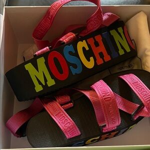 Moschino Hot Pink Strappy Platform Sandals with Multicolor Logo.